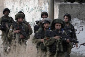 A poster of late Palestinian leader Yasser Arafat hangs on an electri