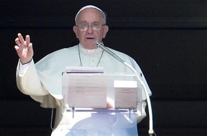 Pope Francis salutes the crowd from the window of the apostolic palac