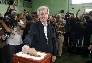 Uruguayan presidential candidate for the ruling Frente Amplio party Tabare Vasquez casts his vote in a polling station in Montevideo
