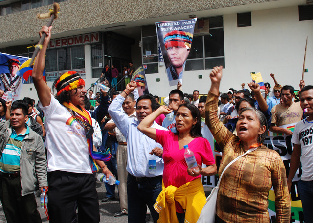 Ecuadorian Shuar Indians protest outside the courthouse in Quito shortly after former Indian leader Pepe Acacho arrived for a hearing February 7, 2011. Acacho was detained under accusations of being involved in the death of Shuar Indian school teacher Bosco Wisum during a protest in September 2009 in Macas. REUTERS /Hernan Ramos (ECUADOR - Tags: CRIME LAW SOCIETY CIVIL UNREST) - RTXXKZ7