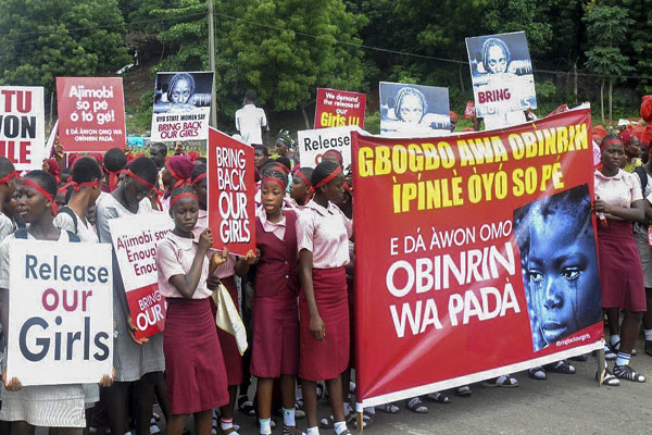 Nigerian people protest for the safe return of the more than 200 girls kidnapped last month.
